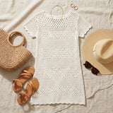 Selvain Crochet Beach Cover-Up flat lay - white crochet dress styled with beach accessories